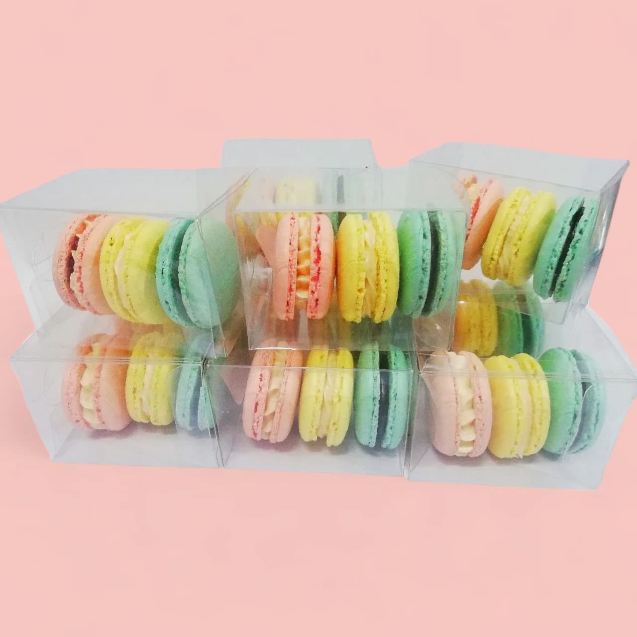 Blue, Yellow, and Pink Macarons in an Acetate Gift Box by Love Bites Cake Hub