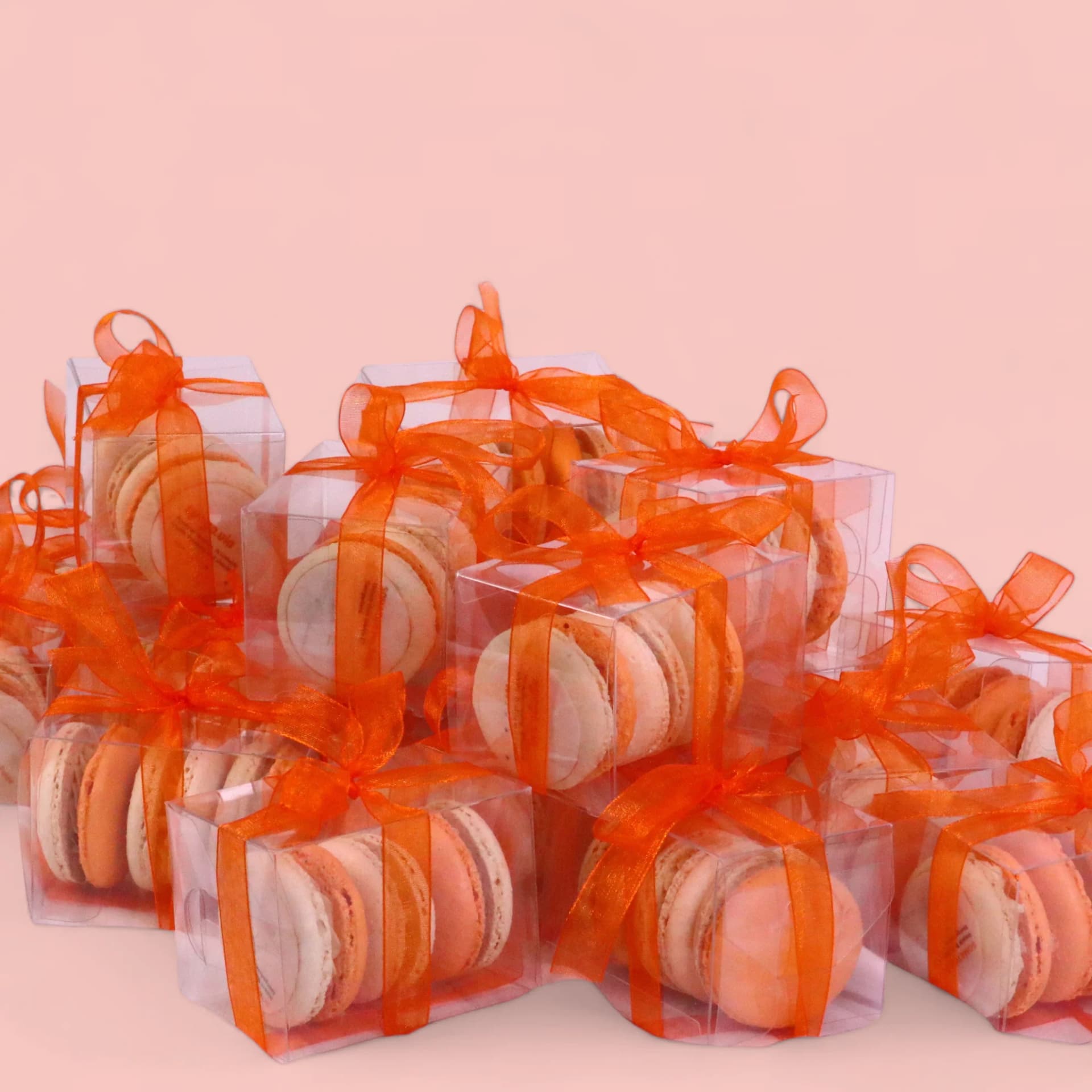 Orange and Beige Macarons in an Acetate Gift Box Wrap with Ribbon by Love Bites Cake Hub