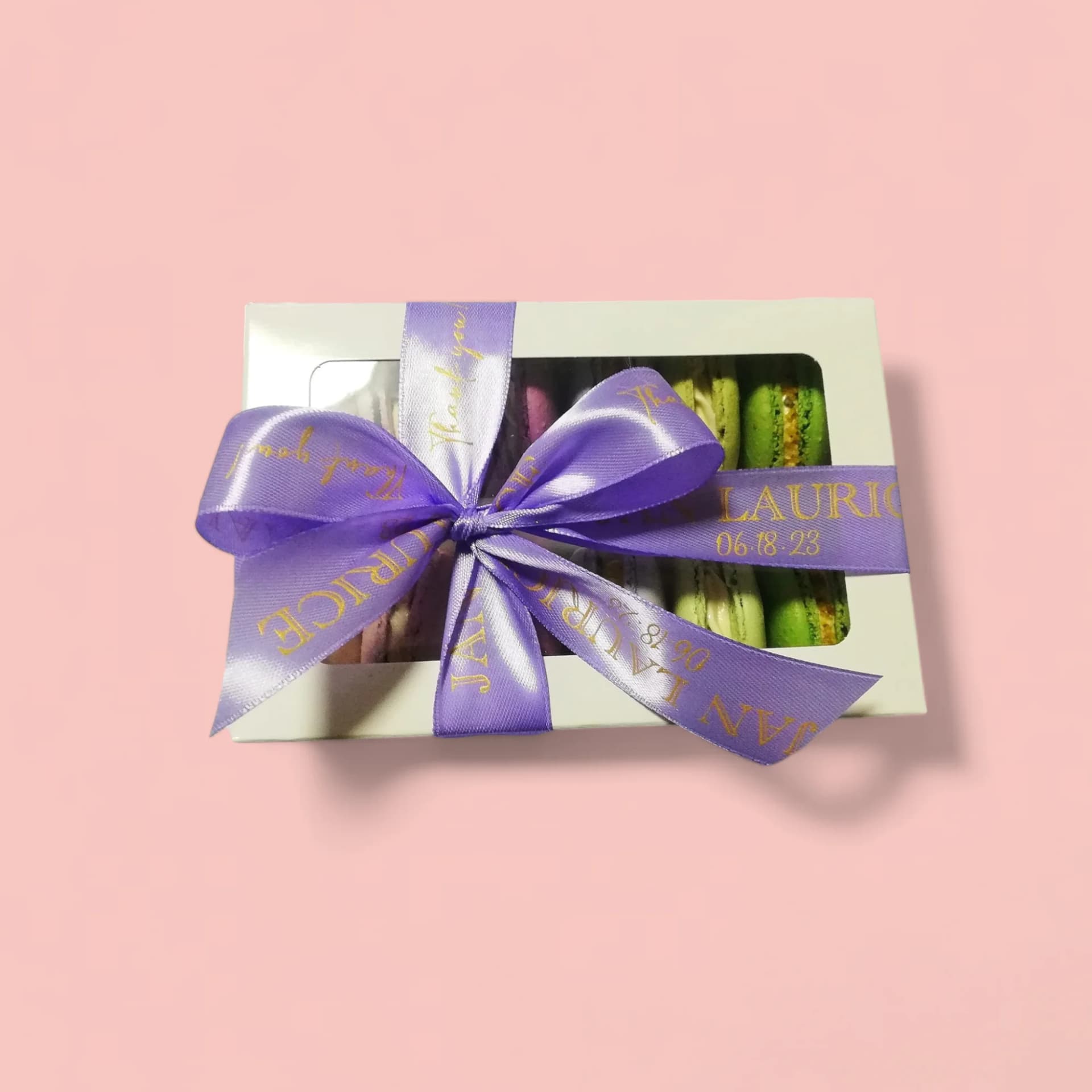 12-Piece Macaron Set in a White Box Wrapped with Purple Ribbon by Love Bites Cake Hub